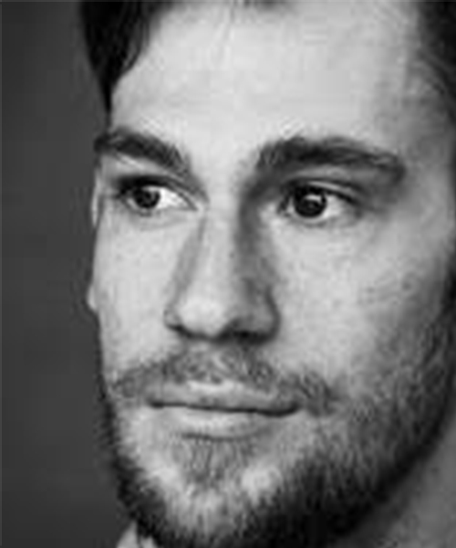 A black and white headshot of Maurizio Giunti